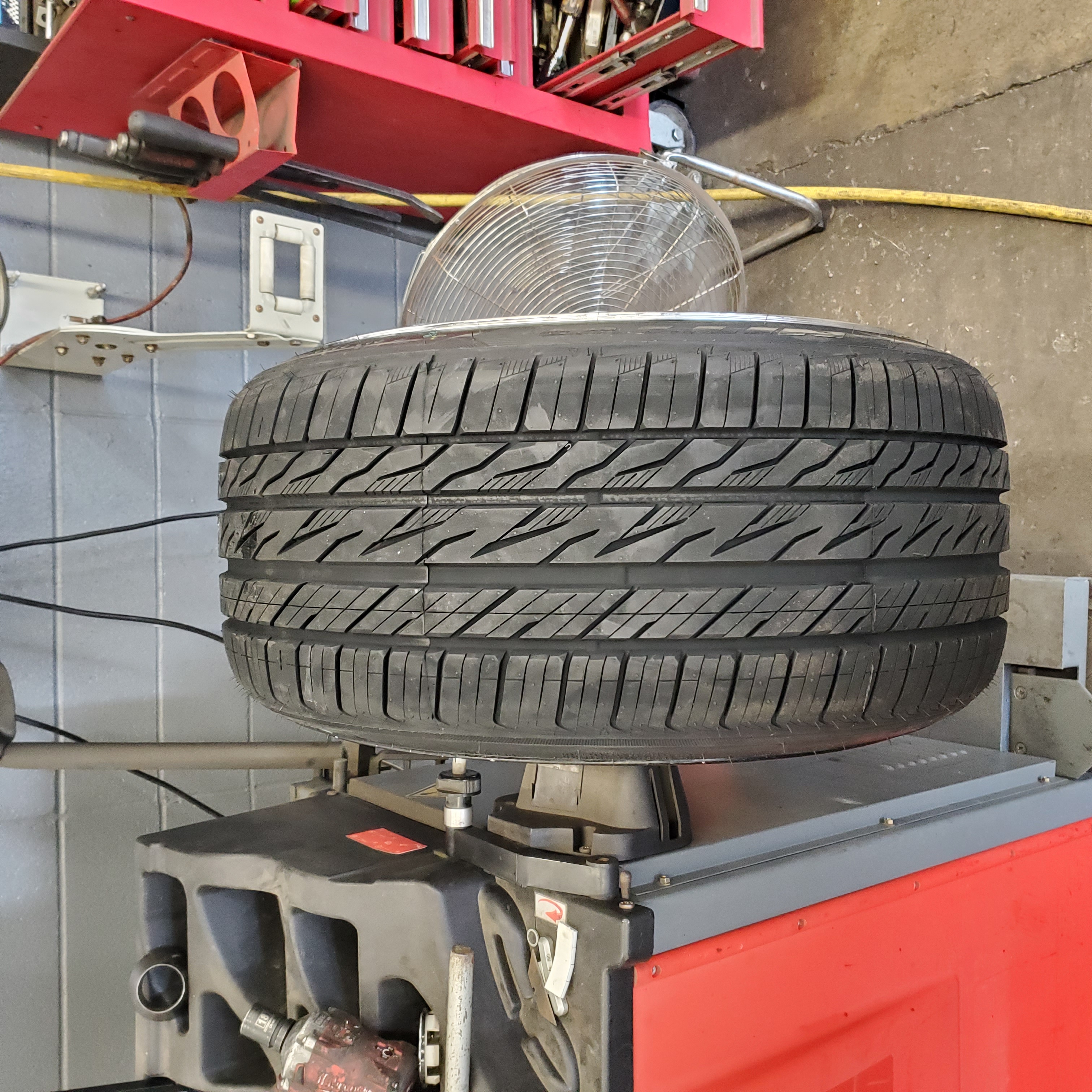 Stretched tire on wheel balancer